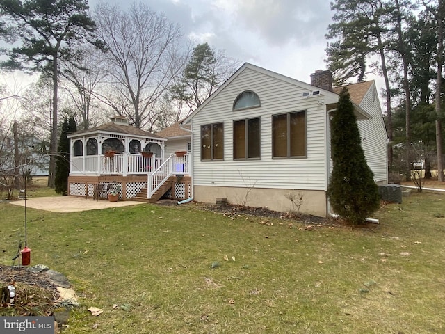 1314 Memory Ln, Hammonton, NJ 08037 - view of front of home with a gazebo, a chimney, a front yard, a patio area, and a wooden deck