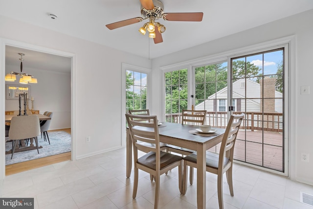 9728 Whetstone Dr, Montgomery Village, MD 20886 - dining room featuring plenty of natural light, baseboards, a chandelier, and ceiling fan