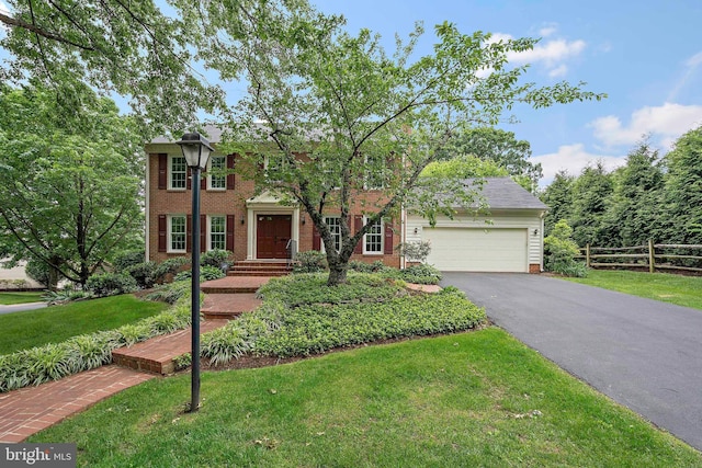 9728 Whetstone Dr, Montgomery Village, MD 20886 - colonial house with brick siding, asphalt driveway, and a garage