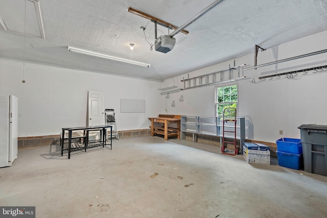 9728 Whetstone Dr, Montgomery Village, MD 20886 - garage featuring a garage door opener and freestanding refrigerator