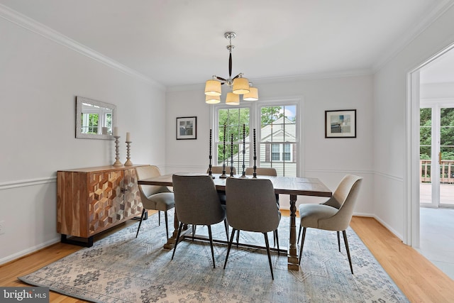 9728 Whetstone Dr, Montgomery Village, MD 20886 - dining room featuring a chandelier, healthy amount of natural light, crown molding, light wood finished floors, and baseboards