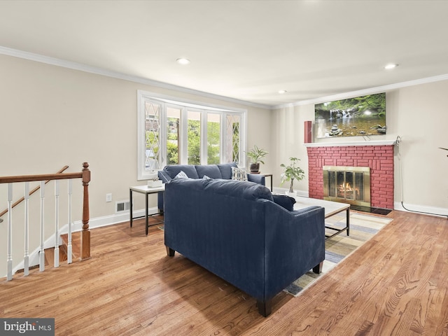1736 Rhodesia Ave, Fort Washington, MD 20744 - living area featuring ornamental molding, wood finished floors, recessed lighting, and a brick fireplace