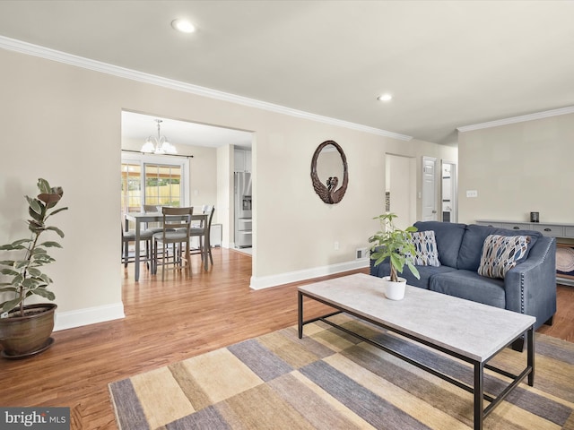 1736 Rhodesia Ave, Fort Washington, MD 20744 - living room featuring wood finished floors, a chandelier, crown molding, and recessed lighting