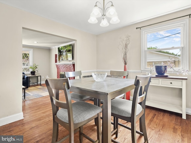 1736 Rhodesia Ave, Fort Washington, MD 20744 - dining room with a chandelier and light wood-style floors