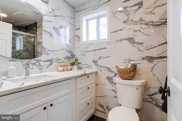 9900 Bird River Rd, Middle River, MD 21220 - bathroom with tile walls, vanity, toilet, and a stall shower