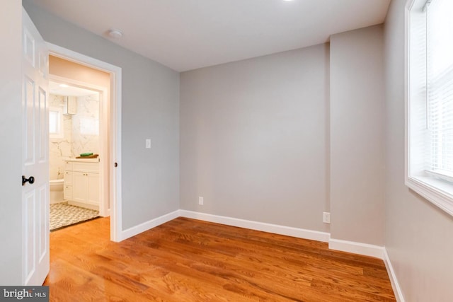 9900 Bird River Rd, Middle River, MD 21220 - unfurnished room featuring light wood-type flooring, a smoke detector, and baseboards