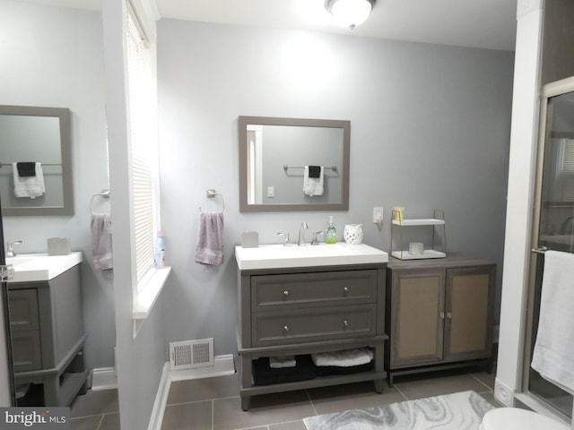 503 Division St, Harrisburg, PA 17110 - full bath with tile patterned floors, vanity, and baseboards