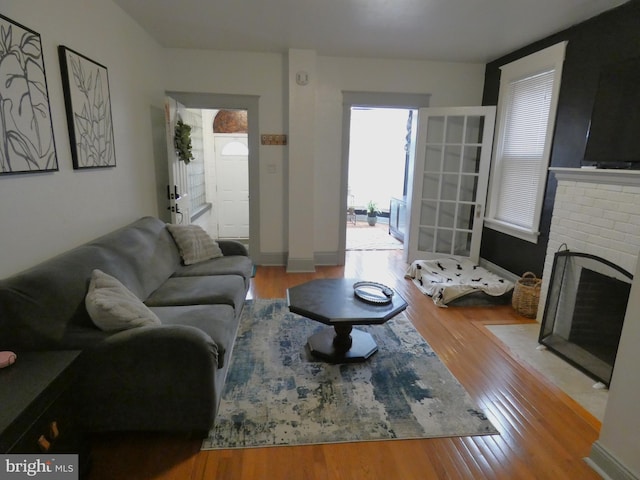 503 Division St, Harrisburg, PA 17110 - living area with wood finished floors and a brick fireplace