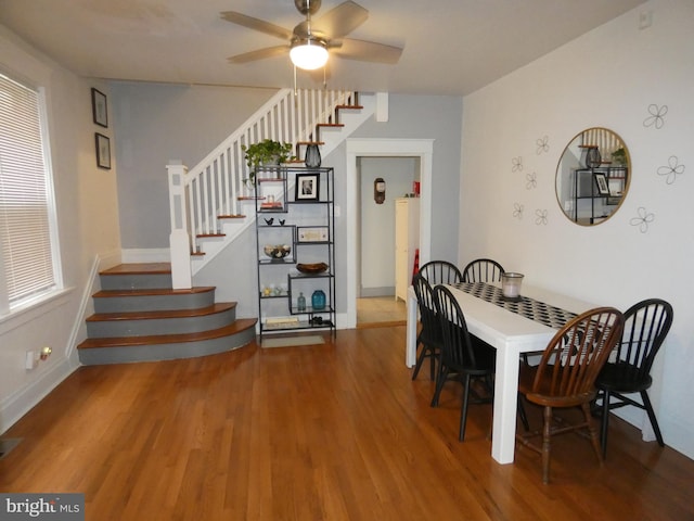 503 Division St, Harrisburg, PA 17110 - dining room with wood finished floors, stairway, a ceiling fan, and baseboards