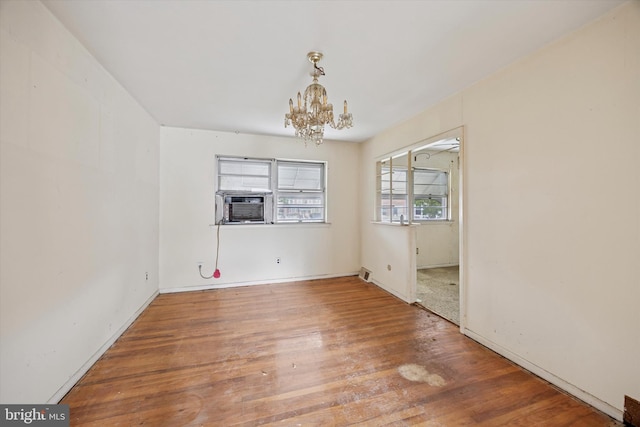 12613 Chilton Rd, Philadelphia, PA 19154 - unfurnished room with a chandelier, wood finished floors, cooling unit, and baseboards