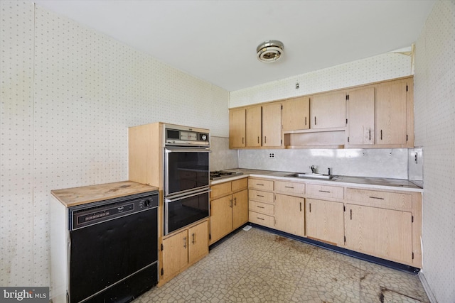 12613 Chilton Rd, Philadelphia, PA 19154 - kitchen featuring black appliances, wallpapered walls, light countertops, a sink, and light flooring