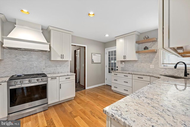 9 Tally Ho Dr, Fredericksburg, VA 22405 - kitchen featuring gas range, premium range hood, a sink, open shelves, and decorative backsplash