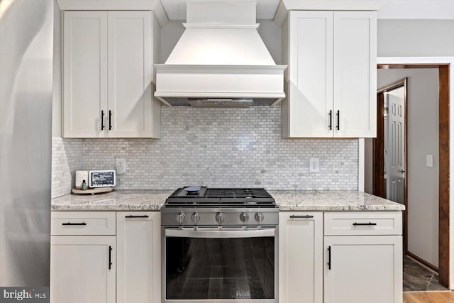 9 Tally Ho Dr, Fredericksburg, VA 22405 - kitchen featuring appliances with stainless steel finishes, premium range hood, backsplash, and white cabinetry