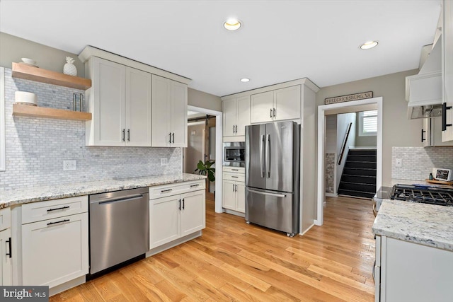 9 Tally Ho Dr, Fredericksburg, VA 22405 - kitchen with appliances with stainless steel finishes, open shelves, decorative backsplash, light wood-style floors, and recessed lighting