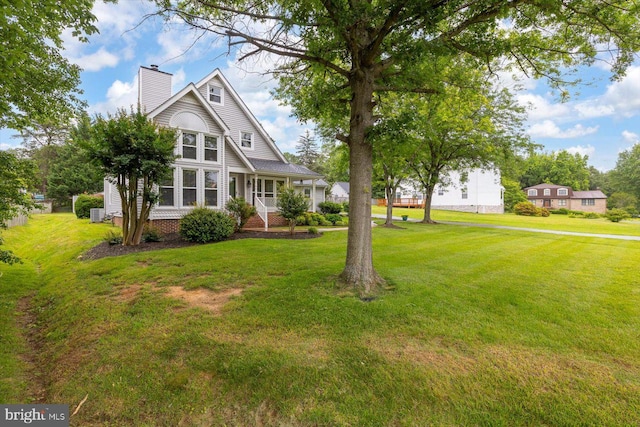 9 Tally Ho Dr, Fredericksburg, VA 22405 - view of front of home featuring a chimney, a front yard, and a porch