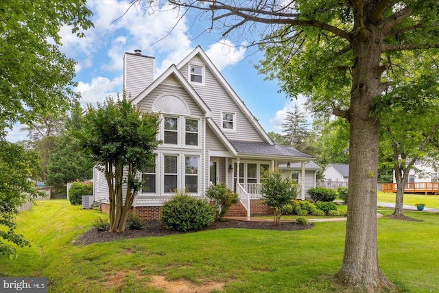 9 Tally Ho Dr, Fredericksburg, VA 22405 - view of front of house featuring a chimney, a front yard, and central air condition unit