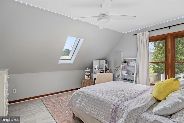 9 Tally Ho Dr, Fredericksburg, VA 22405 - bedroom with a skylight, lofted ceiling, wood finished floors, baseboards, and ceiling fan