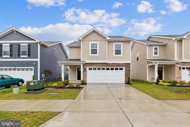 298 Forest Edge Ave, La Plata, MD 20646 - view of front facade featuring concrete driveway, an attached garage, stone siding, a front lawn, and board and batten siding