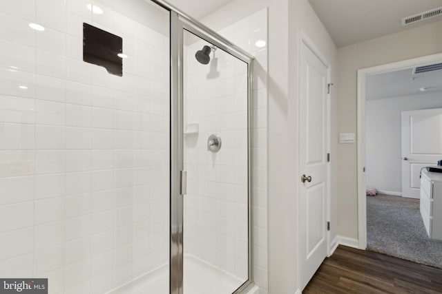 298 Forest Edge Ave, La Plata, MD 20646 - full bathroom with a stall shower, wood finished floors, and baseboards