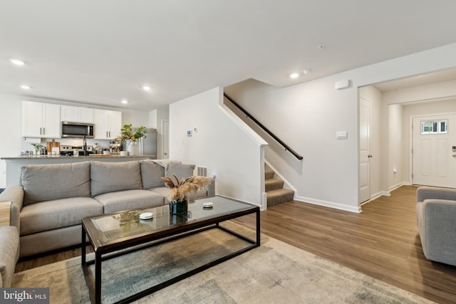 298 Forest Edge Ave, La Plata, MD 20646 - living room featuring light wood finished floors, stairway, recessed lighting, and baseboards