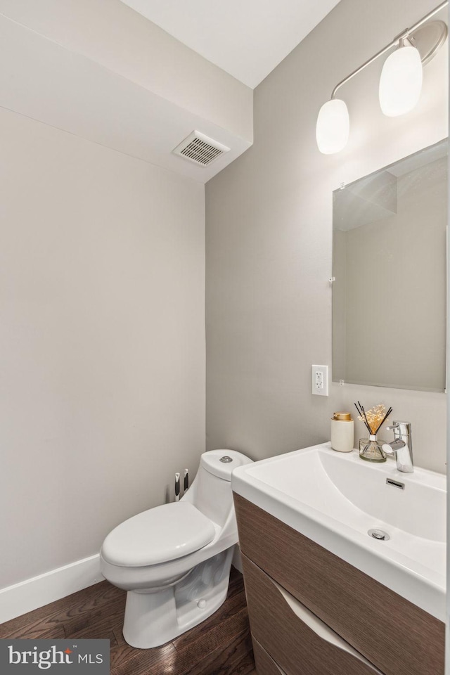 912 N 16th St Unit C, Philadelphia, PA 19130 - bathroom featuring vanity, toilet, wood finished floors, and baseboards