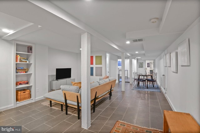 908 Westminster St NW, Washington, DC 20001 - living area with recessed lighting, built in shelves, and dark tile patterned floors