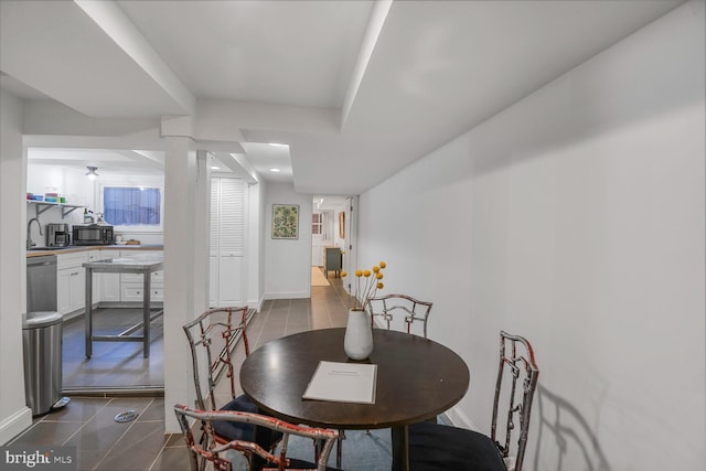 908 Westminster St NW, Washington, DC 20001 - dining room featuring dark tile patterned floors and baseboards