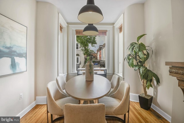 908 Westminster St NW, Washington, DC 20001 - dining area featuring baseboards and light wood-style floors