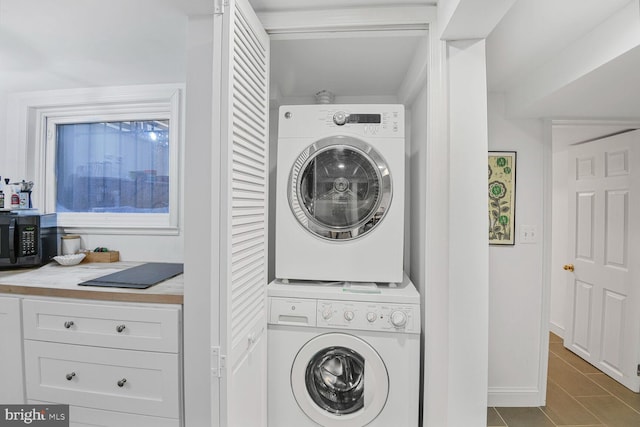 908 Westminster St NW, Washington, DC 20001 - washroom with stacked washer / drying machine and tile patterned flooring