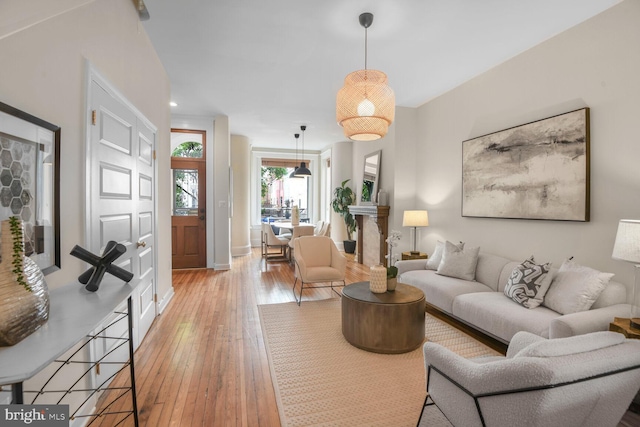 908 Westminster St NW, Washington, DC 20001 - living area featuring light wood-style flooring and baseboards