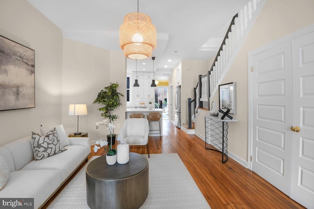 908 Westminster St NW, Washington, DC 20001 - living area with wood finished floors, stairs, and baseboards