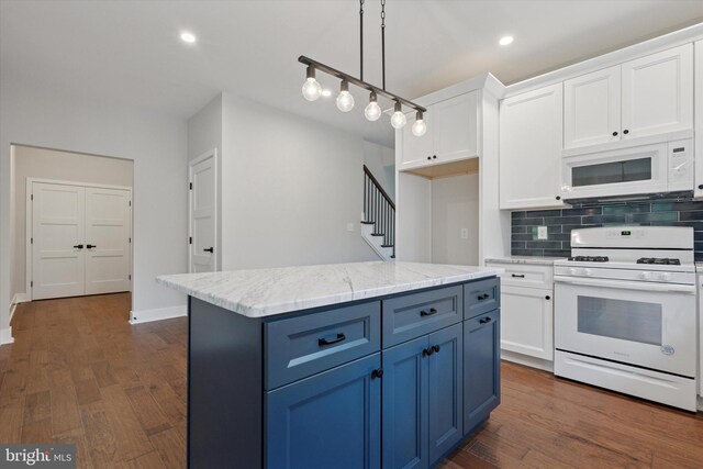 721 Walden Rd, Elkins Park, PA 19027 - kitchen with white appliances, blue cabinets, white cabinets, decorative backsplash, and recessed lighting