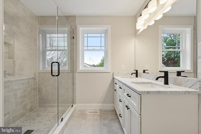 721 Walden Rd, Elkins Park, PA 19027 - bathroom with plenty of natural light, baseboards, double vanity, and a shower stall