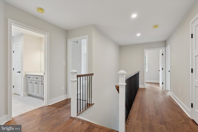 721 Walden Rd, Elkins Park, PA 19027 - hallway with an upstairs landing, wood-type flooring, recessed lighting, and baseboards