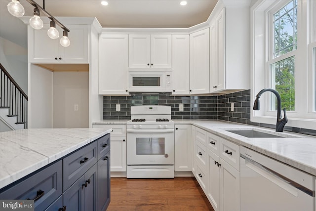 721 Walden Rd, Elkins Park, PA 19027 - kitchen with white appliances, white cabinetry, a sink, recessed lighting, and plenty of natural light