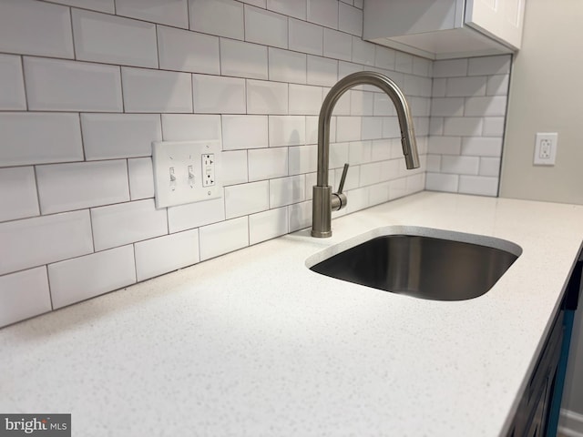 6901 Valley Ave Unit I1, Philadelphia, PA 19128 - kitchen view of a sink, decorative backsplash, and light stone countertops