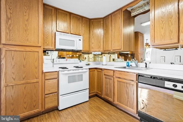 151 Elmtowne Blvd, Hammonton, NJ 08037 - kitchen featuring white appliances, a sink, light wood finished floors, and light countertops
