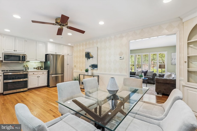 8305 Toll House Rd, Annandale, VA 22003 - dining space featuring wallpapered walls, ornamental molding, light wood-style flooring, ceiling fan, and recessed lighting