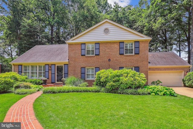 8305 Toll House Rd, Annandale, VA 22003 - view of front of house with brick siding, a front yard, a garage, and driveway