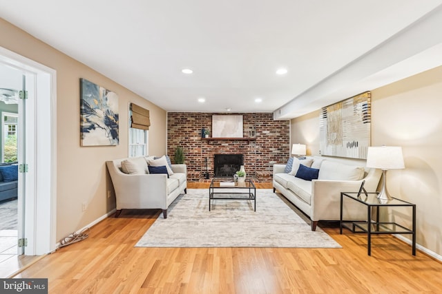 8305 Toll House Rd, Annandale, VA 22003 - living room with wood finished floors, a brick fireplace, and recessed lighting