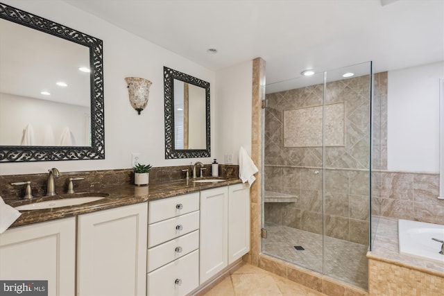 8305 Toll House Rd, Annandale, VA 22003 - bathroom featuring a stall shower, a garden tub, double vanity, recessed lighting, and tile patterned floors