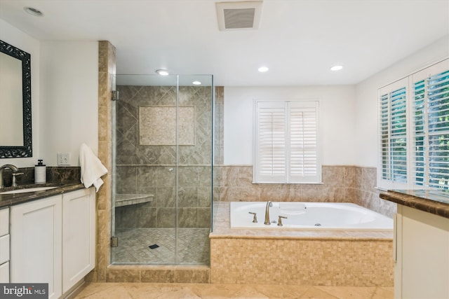 8305 Toll House Rd, Annandale, VA 22003 - bathroom with vanity, a tub with jets, a stall shower, recessed lighting, and tile patterned floors