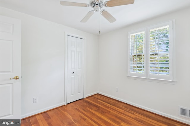 8305 Toll House Rd, Annandale, VA 22003 - unfurnished bedroom with wood finished floors, a closet, and a ceiling fan