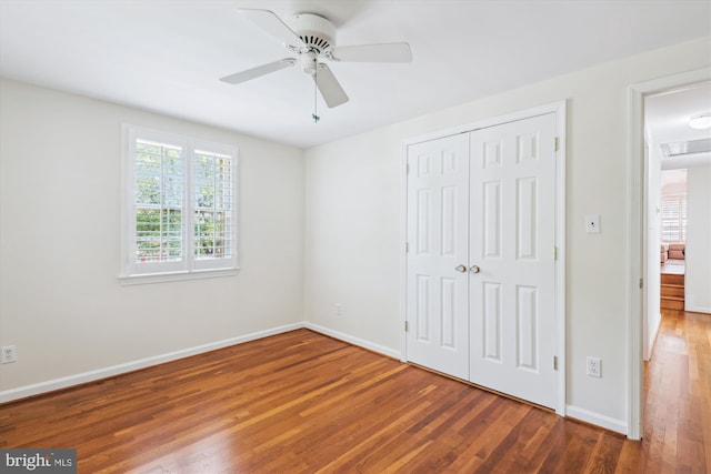 8305 Toll House Rd, Annandale, VA 22003 - unfurnished bedroom featuring a closet, wood finished floors, and ceiling fan