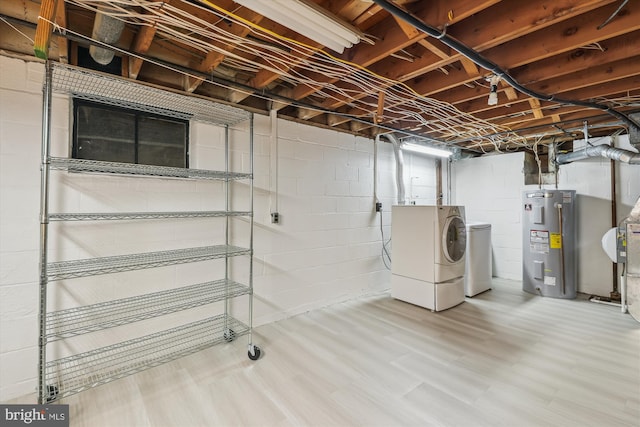 8305 Toll House Rd, Annandale, VA 22003 - unfinished basement featuring electric water heater, washer and clothes dryer, and wood finished floors