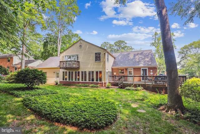 8305 Toll House Rd, Annandale, VA 22003 - back of house featuring brick siding, a lawn, a balcony, and a wooden deck