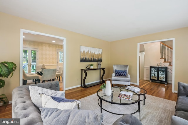 8305 Toll House Rd, Annandale, VA 22003 - living room with wood finished floors, stairway, french doors, and wallpapered walls