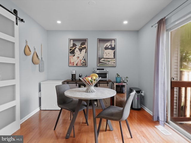 12215 Wye Oak Commons Cir Unit 66, Burke, VA 22015 - dining room with a barn door, light wood-style flooring, recessed lighting, and baseboards