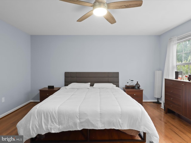 12215 Wye Oak Commons Cir Unit 66, Burke, VA 22015 - bedroom featuring wood finished floors, baseboards, and ceiling fan