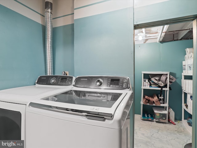 12215 Wye Oak Commons Cir Unit 66, Burke, VA 22015 - washroom with washer and dryer and marble look tile flooring